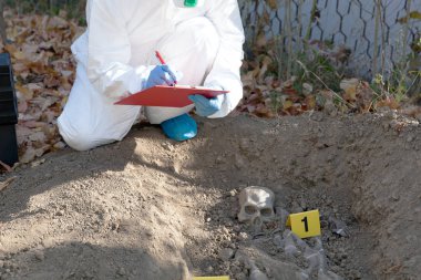 Exhumation: Forensic science specialist at work clipart