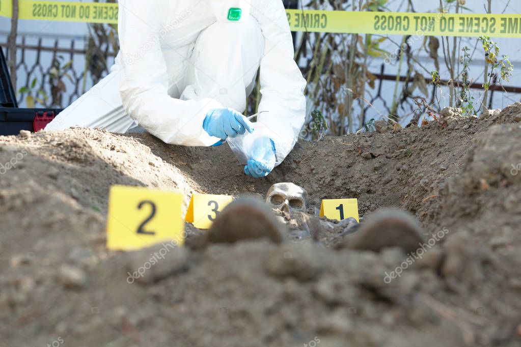 Exhumation: Forensic science specialist at work