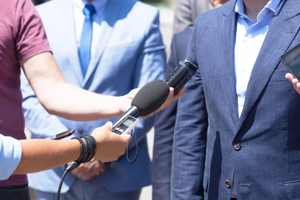 Group of journalists recording speech of business person or politician during press conference — Stock Photo, Image