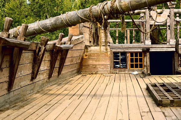 Deck of the old wooden ship. Old desert piracy ship. Interior of the sailing wooden vessel.