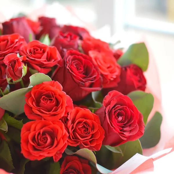 Beautiful lovely bouquet of red roses for flower shop. Concept of flower shop.  Bouquet for catalog