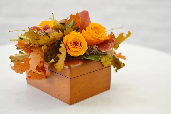 Flower composition in original hatbox. Beautiful flowers in stylish hat box. Concept of flower salon. Photo for flower website or catalog