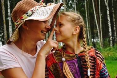 Happy mom with daughter have fun outdoor. Greeting card for mom'
