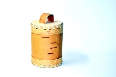 birch bark vessel on white background. Capacity of birch bark. Handmade wooden bottle.