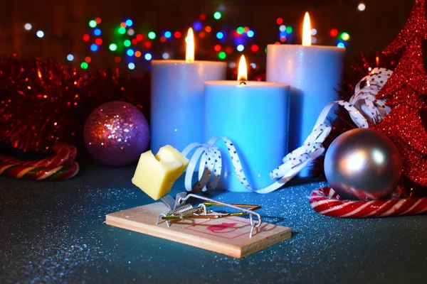 Year of the mouse 2020. New Year's funny decor. Mousetrap with cheese and candles on the table. — Stock Photo, Image