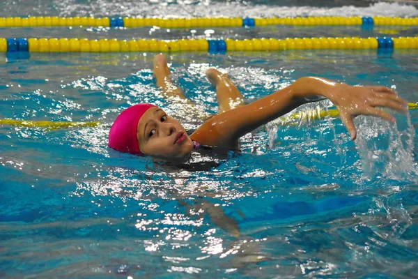 girl swims in the Indoor pool.