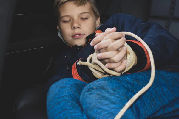 Kidnapping and selling children into slavery. rescue of boy from captivity — Stock Photo, Image