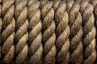 Sıkı bir şekilde yara ip yakın çekim doku. Düşük anahtar. Arka plan için idealdir. Periyodik olarak, tekrarlama, ritim, shibari kavramı