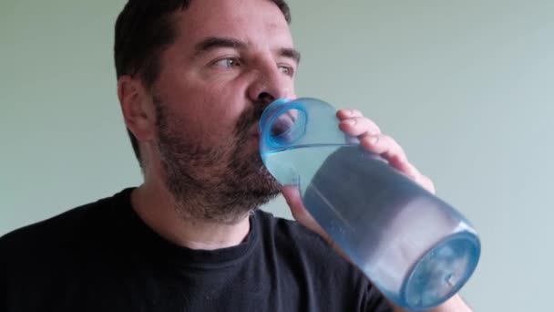 Portrait Happy Adult Bearded Man Black Shirt Drinks Water Bottle — Stock Video