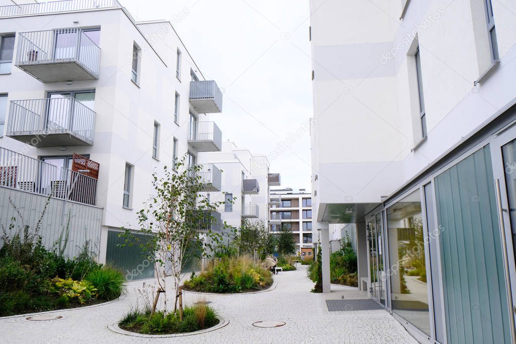 Sidewalk in a cozy courtyard of modern apartment buildings condo