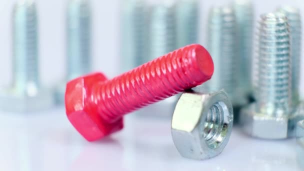 Rotating Group Galvanized Metallic Screws Close One Them Pink Colored — Stock Video