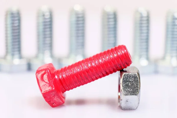 Closeup Pink Bolt Nut Group Galvanized Metallic Screws Leadership Dominance — Stock Photo, Image