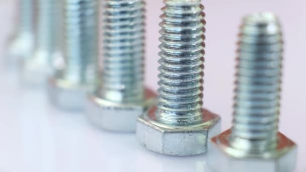 Moving Row Galvanized Metallic Screws Close Stainless Steel Bolts Isolated — Stock Video