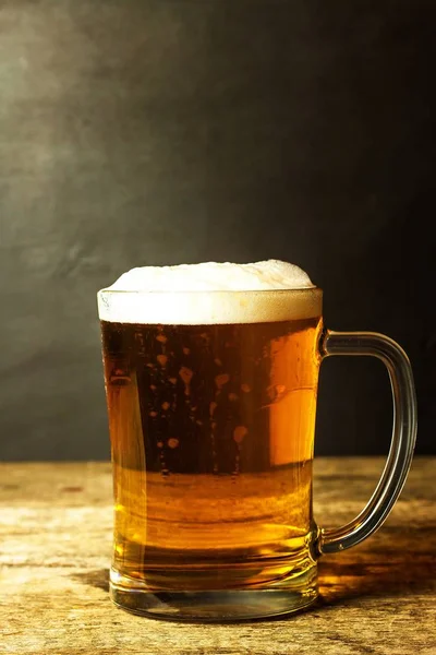Glass of beer on a black background. Sales of alcohol. Beer in a glass. Czech beer.