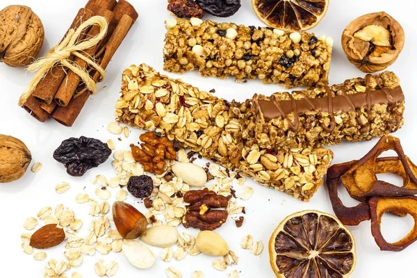 Muesli bar on a white background. Healthy food. Protein diet. Healthy sweetness. Oatmeal and dried fruits.