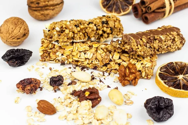 Muesli bar on a white background. Healthy food. Protein diet. Healthy sweetness. Oatmeal and dried fruits.
