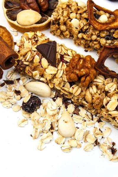 Muesli bar on a white background. Healthy food. Protein diet. Healthy sweetness. Oatmeal and dried fruits.