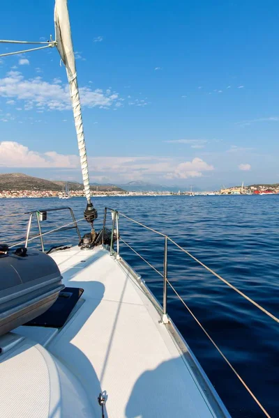 Sailboat sails to the port of Trogir in Croatia. View from deck of sailboat. Historic town on the Adriatic. Holiday in Croatia. Yachting sport.