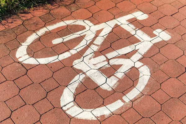 Bicycle sign or icon on the road in the city. Bike path. Bicycle symbol on city street