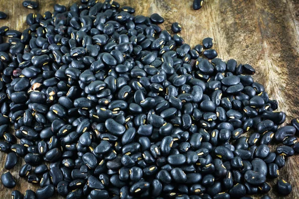 black bean on basket / pile of black food black beans grain seeds on  wood background