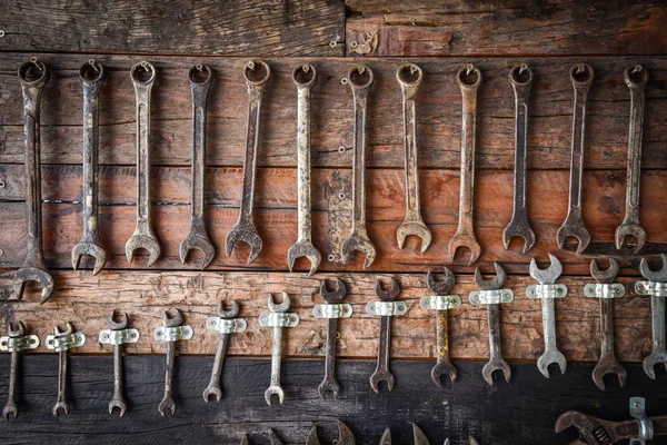 Craftsman tool Wrench manual / auto service mechanic tools with old wrench on wooden wall - Set mechanical tools Craftsman using for working or repair in auto car service