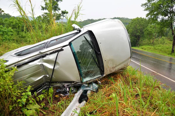 insurance car accident scene / the van car accident on the road with - car overturned on the street slippery road after rain and wet