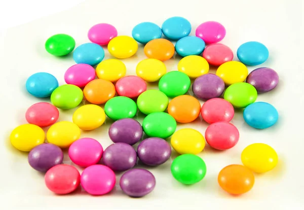 Colorful candies colored / Close up of pile multi color sweety candy chocolate coated isolated on white background