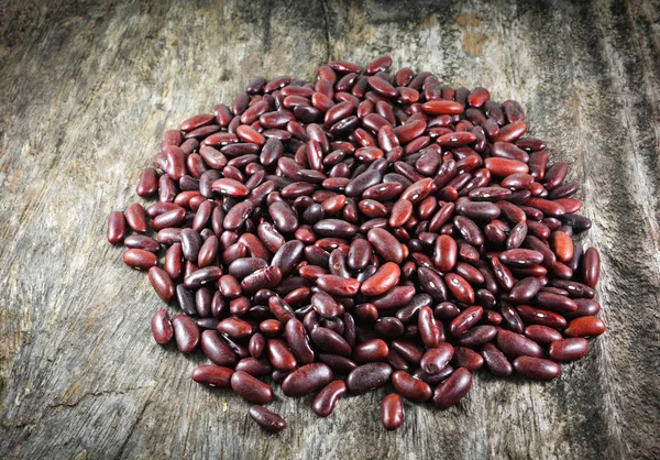 Red beans azuki or red kidney bean grain seed on rustic wood background