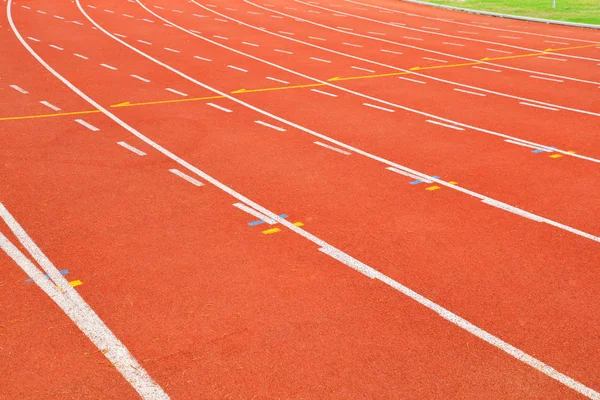 Athletics Track Run / Red running track in stadium with green field with white line in sports outdoor on stadium