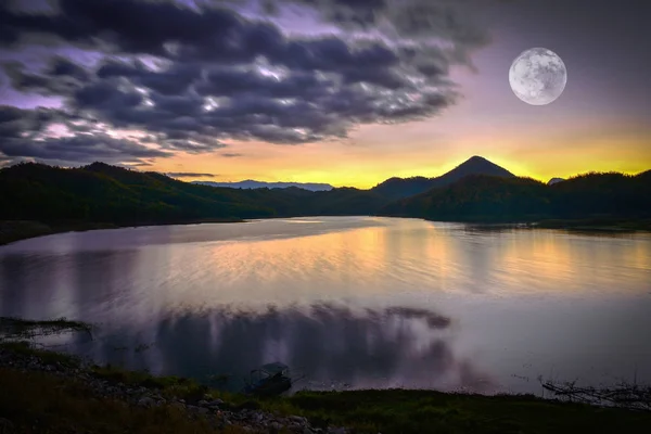 Landscape lake river nature with full moon sunset yellow and pur — Stock Photo, Image