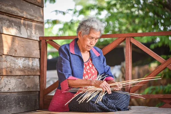 Asia life old woman working in home / Grandmother serious living