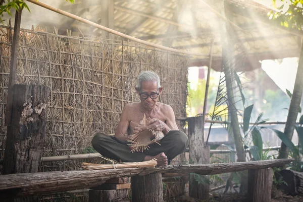 Asia life old man uncle grandfather working in home / Man elderl