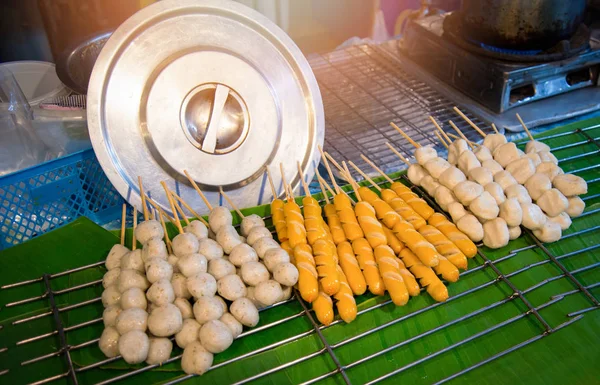 Meat ball , fish ball and hot dog cooking steamed food on grill