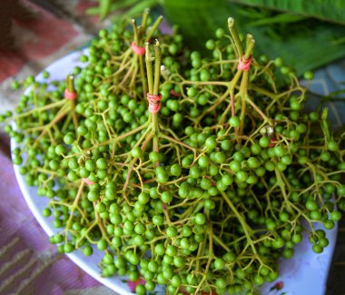 Fresh sichuan pepper fruits for sale in local market clipart