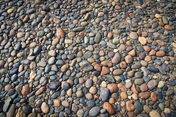 Seixos fundo / Praia de pedra natural — Fotografia de Stock