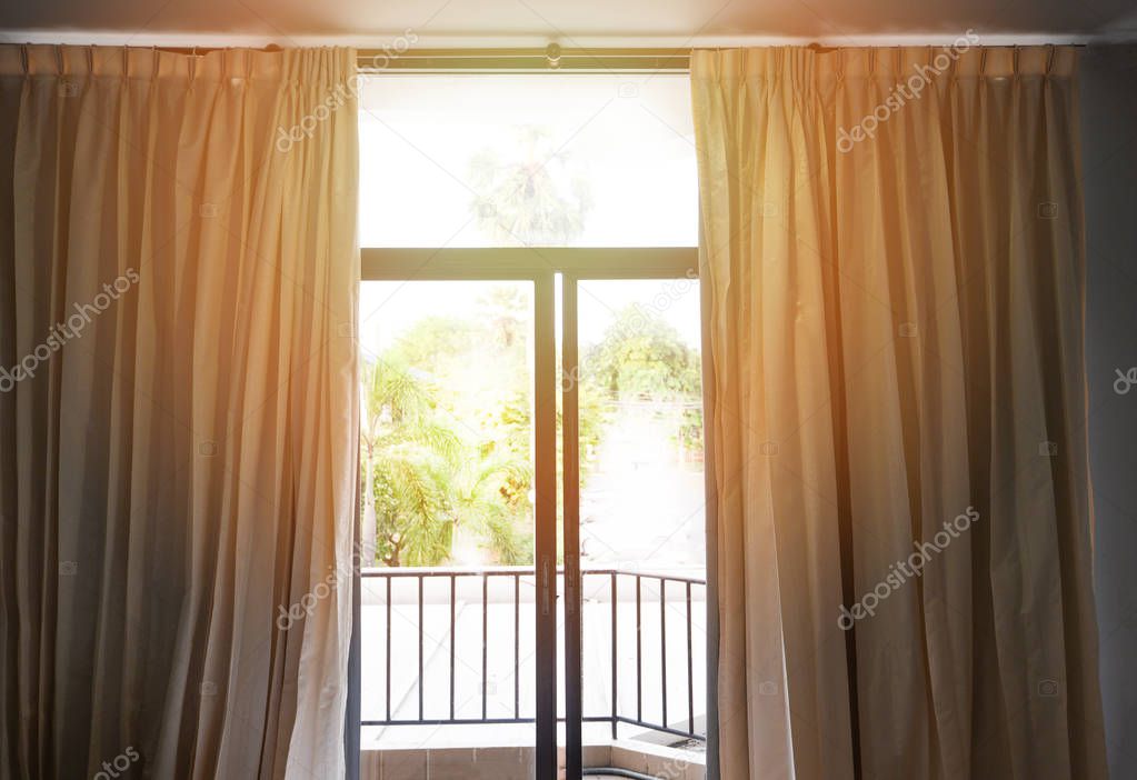 bedroom window in the morning / sunlight through in room open cu
