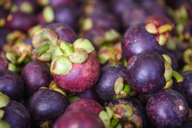 Satılık doku arka plan üzerinde Mangosteen tropikal meyve 