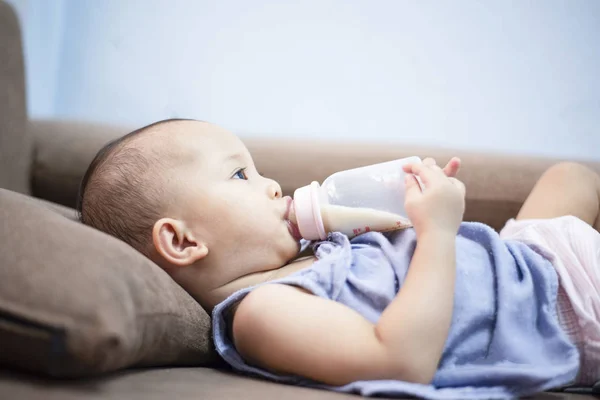 Baby feeding bottle - Closeup portrait of asia child hold milk b — Stock Photo, Image