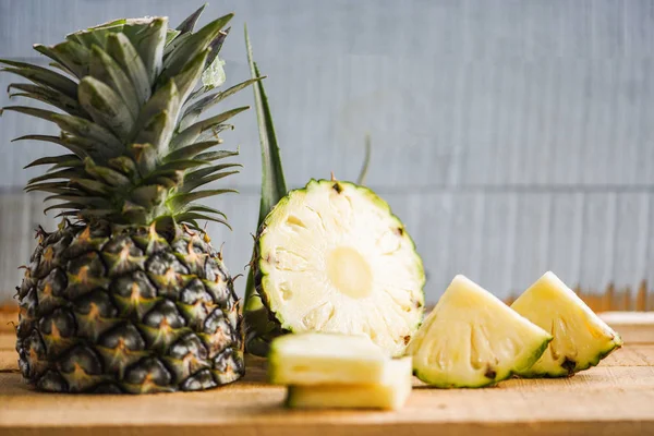 pineapple slice on wooden table - Fresh pineapple summer fruit