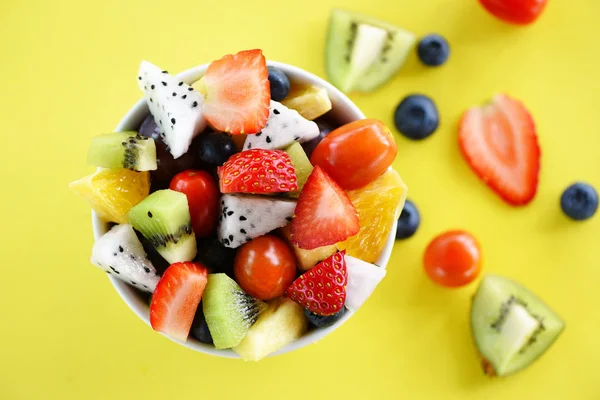 Fruit salad bowl fresh summer fruits and vegetables healthy orga