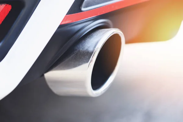 Exhaust pipe on the modern car close up - car pollution concept