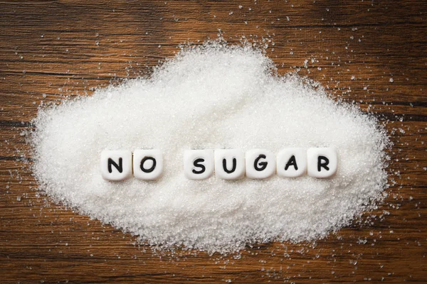 No sugar text blocks with white sugar on wooden background - sug — Stock Photo, Image