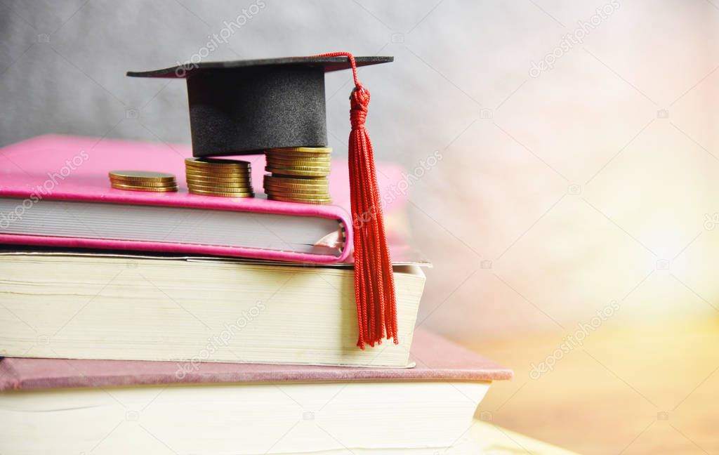 Scholarships education concept with graduation cap on coin money