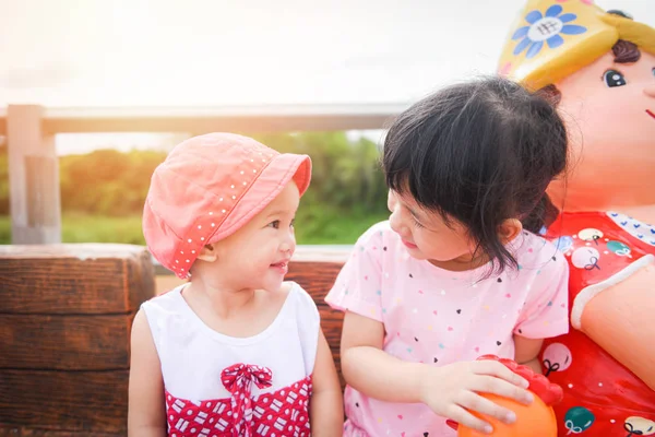 Little girl look in the eyes - Children having fun playing outsi — Stock Photo, Image