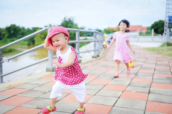 Children having fun playing outside Asian kids girl running happ — Stock Photo, Image