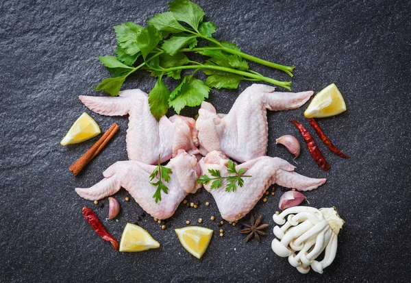 raw chicken wings with lemon chilli herbs and spices and mushroo