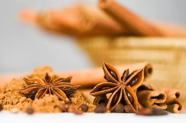 Cinnamon sticks and Star Anise on cinnamon powder herbs and spic