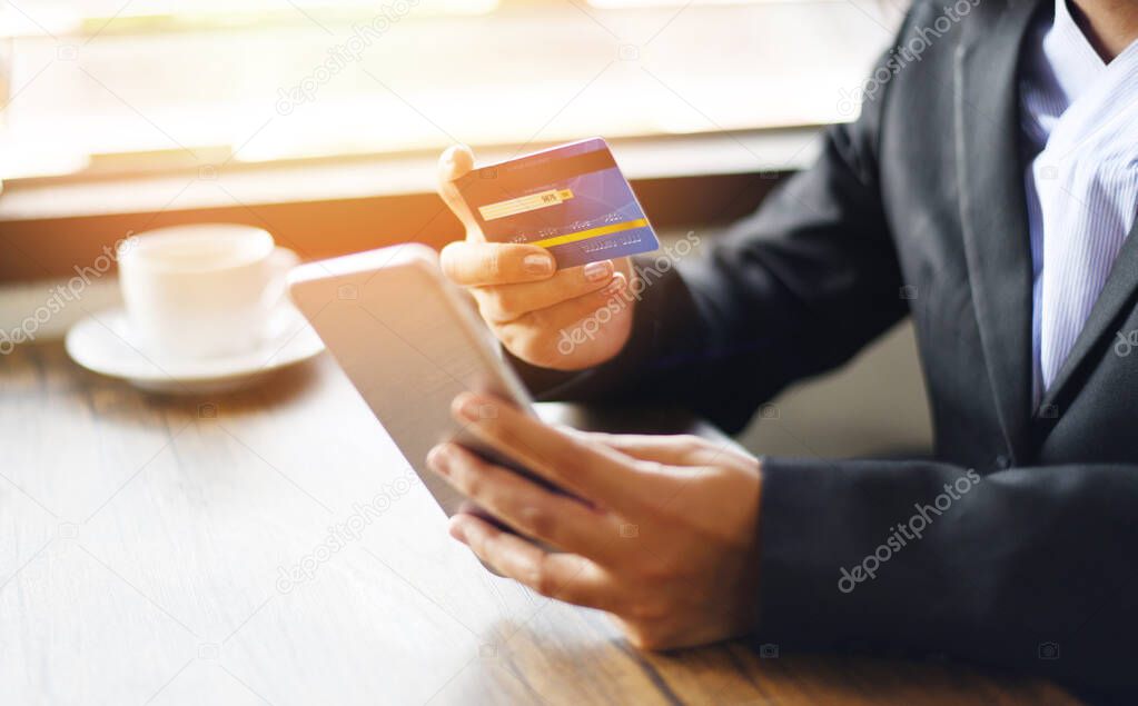 business woman hands holding credit card and using smartphone fo