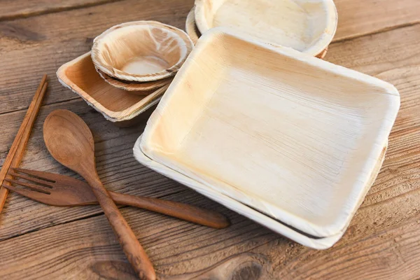 Natural eco-friendly food packaging disposable utensils with dish plate bowl cup and wooden fork spoon / Eco friendly disposable tableware from palm leaf or betel nut , zero waste environment concept — Stock Image Natural Eco Friendly Food Packaging Disposable Utensils Dish Plate Bowl Royalty Free Stock Photos