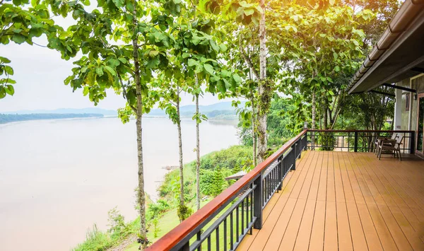 balcony and nature green tree forest / balcony view river , terrace house